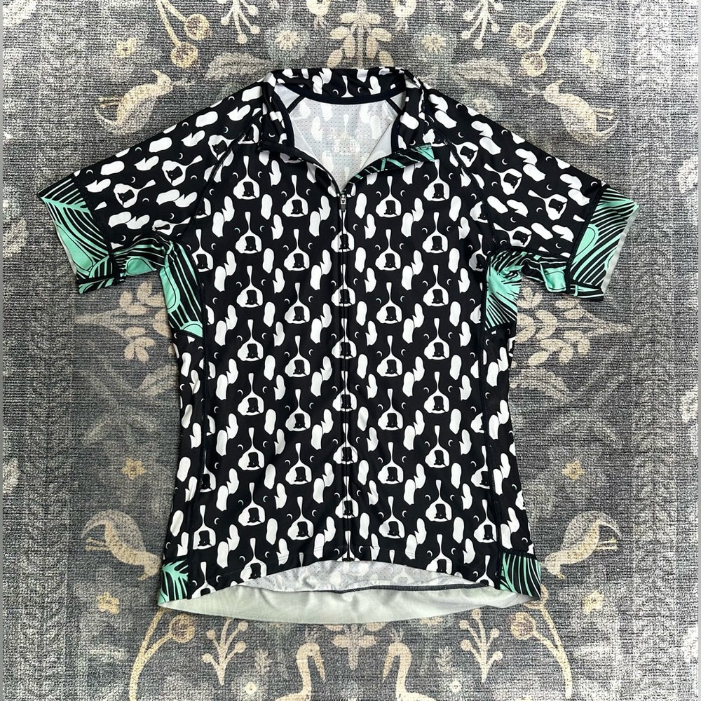 SheBeest Divine Short Sleeve Zip Front Jersey in the "Pups & Palms" print